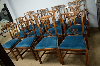 Lot 88 - Chapmans: twelve chairs and a twin pedestal dining table.