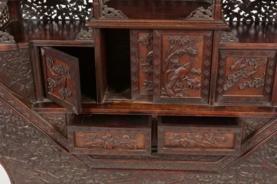 Lot 847 - A Japanese carved netsuke display cabinet.
