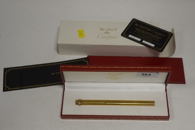 Lot 363 - A Must de Cartier gold-painted ballpoint pen.