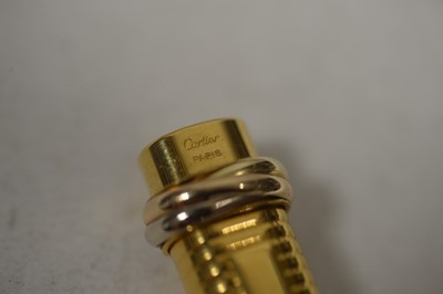 Lot 363 - A Must de Cartier gold-painted ballpoint pen.