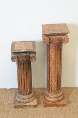 Lot 101 - Two Asian hardwood column stands.