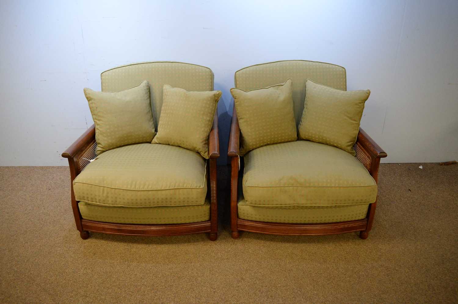 Lot 15 - Pair of Ercol teak Bergere chairs.