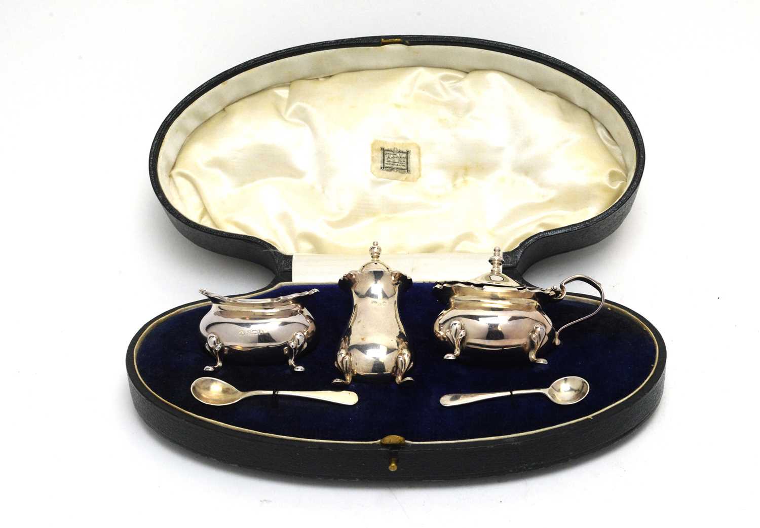 Lot 189 - A George V silver three-piece condiment set.