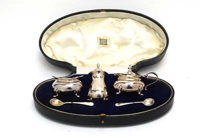 Lot 189 - A George V silver three-piece condiment set.
