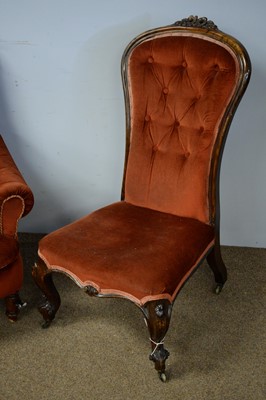 Lot 28 - Victorian rosewood nursing chair; and a red upholstered armchair.