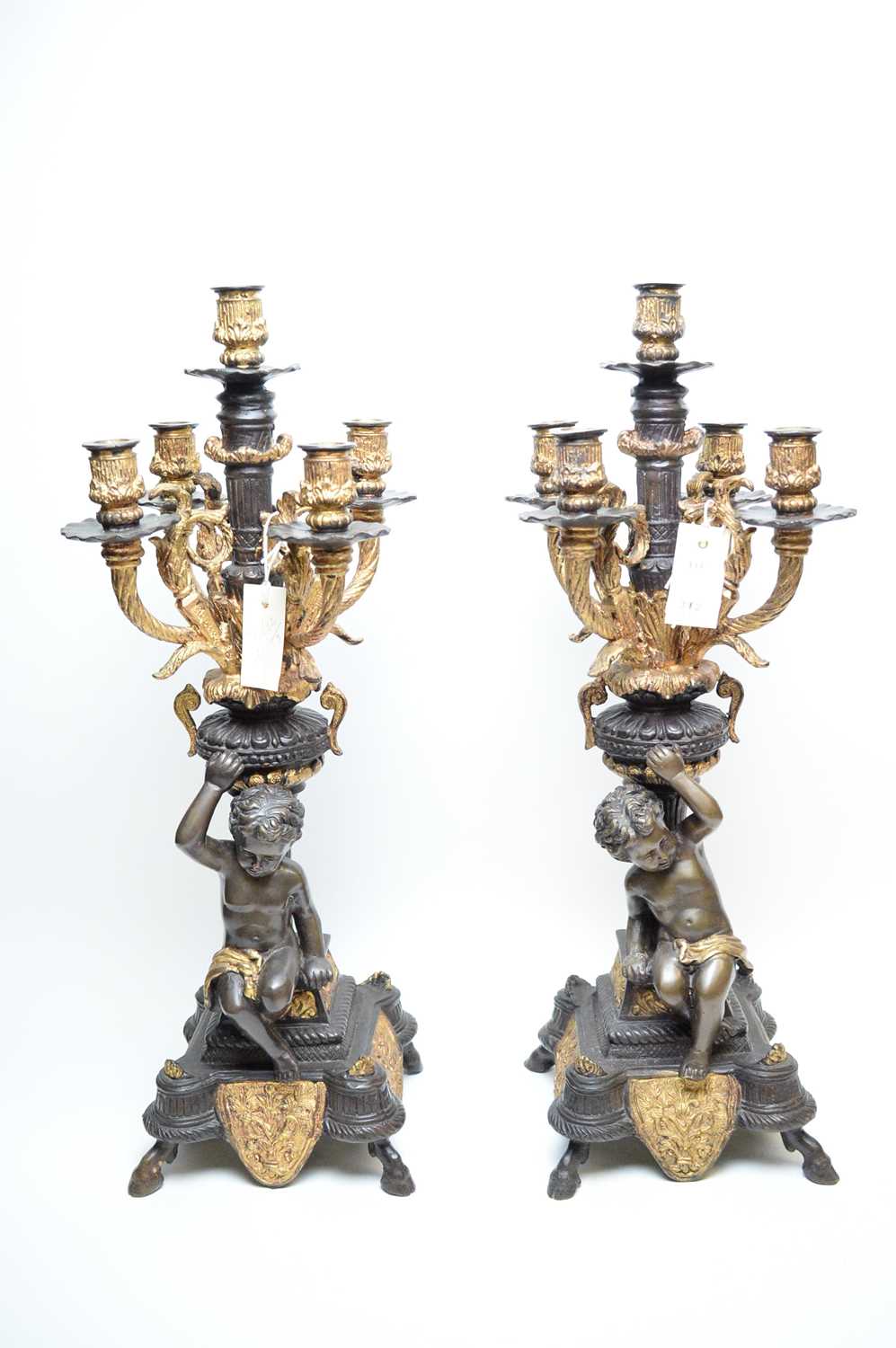 Lot 312 - Pair of repro bronzed and giltmetal four-branch candelabra.