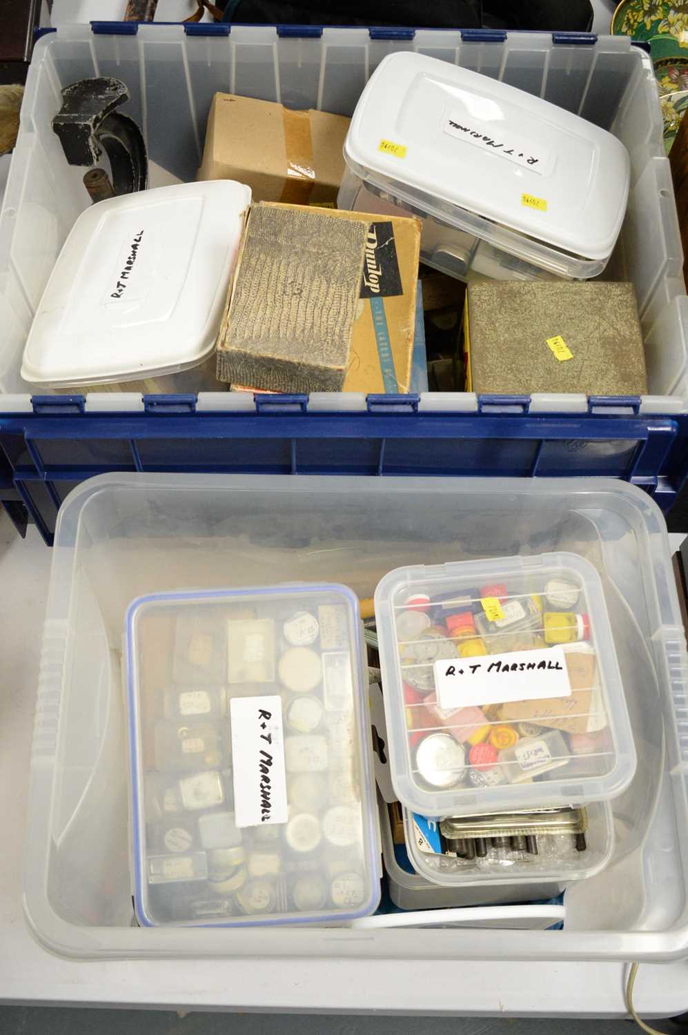 Lot 267 - Two plastic bins of watchmaking parts and tools.