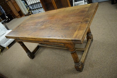 Lot 110 - Substantial 17th C style oak draw leaf dining table.