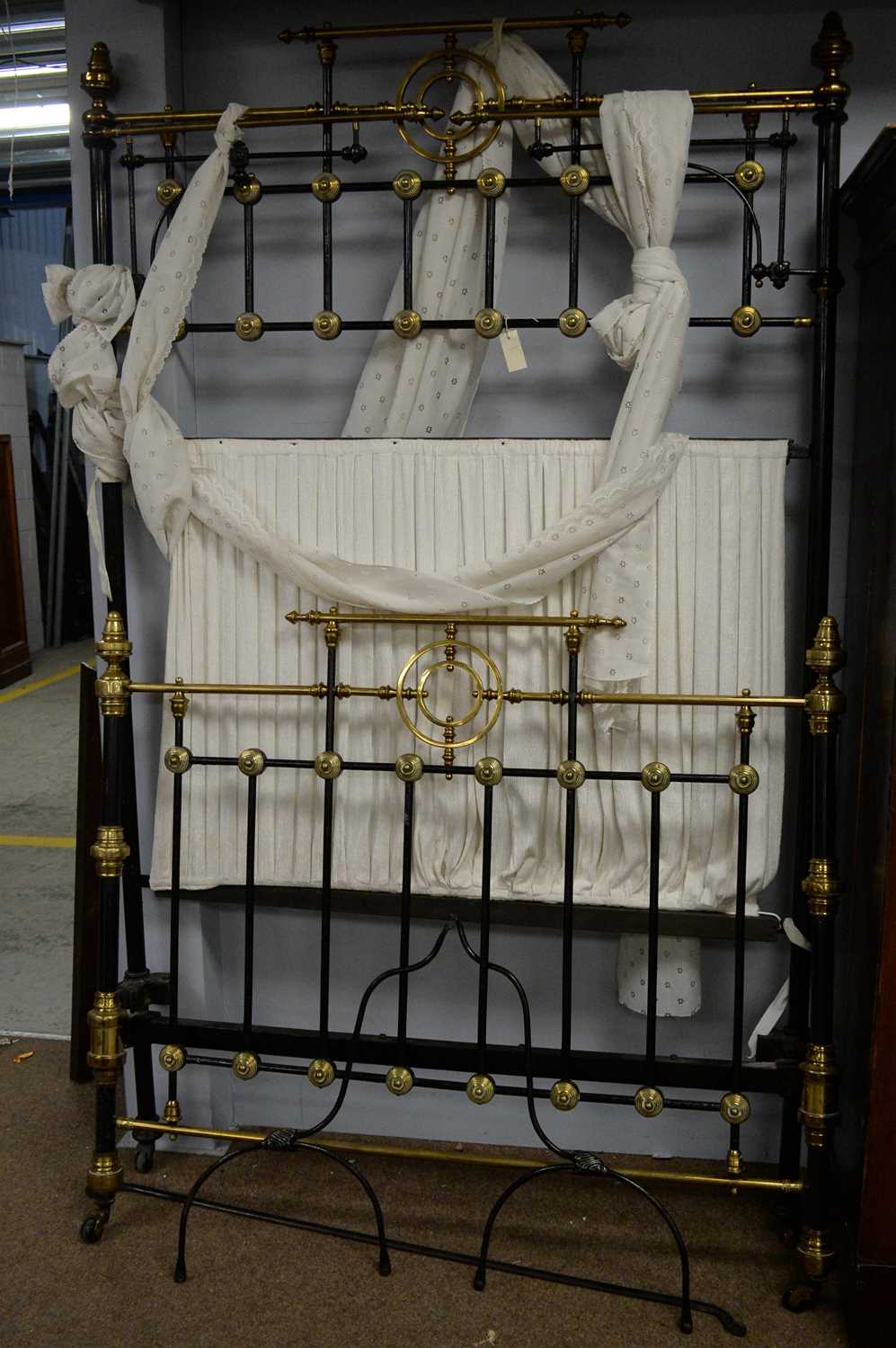 Lot 115 - Victorian black painted and brass half tester bed.