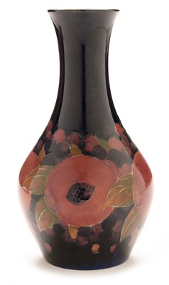 Lot 498 - William Moorcroft pomegranate vase.