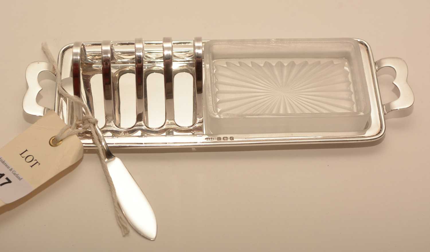 Lot 217 - A silver toast rack and butter dish