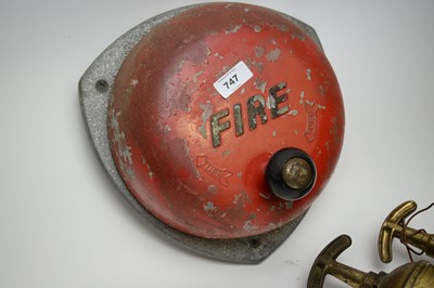 Lot 747 - Three vintage fire extinguishers; and a wall-mount fire alarm bell.