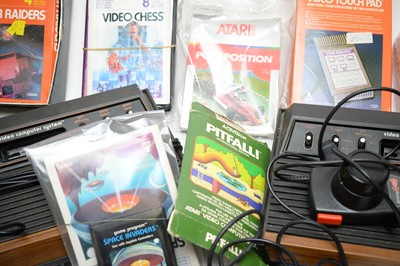 Lot 781 - Two vintage Atari video computer game consoles and accessories.