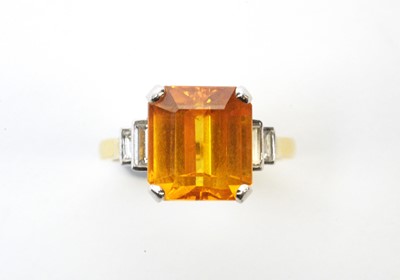 Lot 49 - An orange sapphire and diamond ring