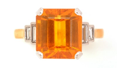 Lot 49 - An orange sapphire and diamond ring