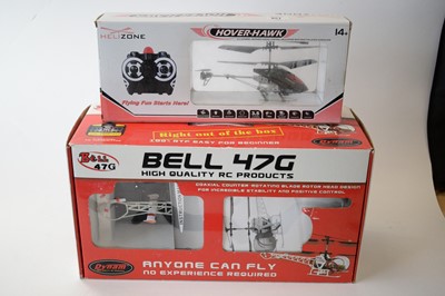 Lot 851 - Two radio controlled model helicopters.