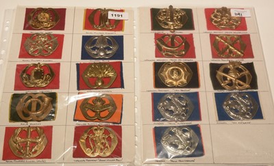 Lot 1191 - A collection of 19 Dutch Military cap badges on felt backing.
