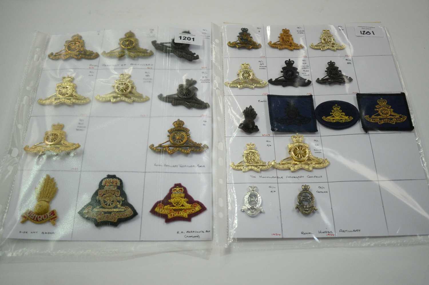 Lot 1201 - A collection of 26 Royal Artillery cap badges.