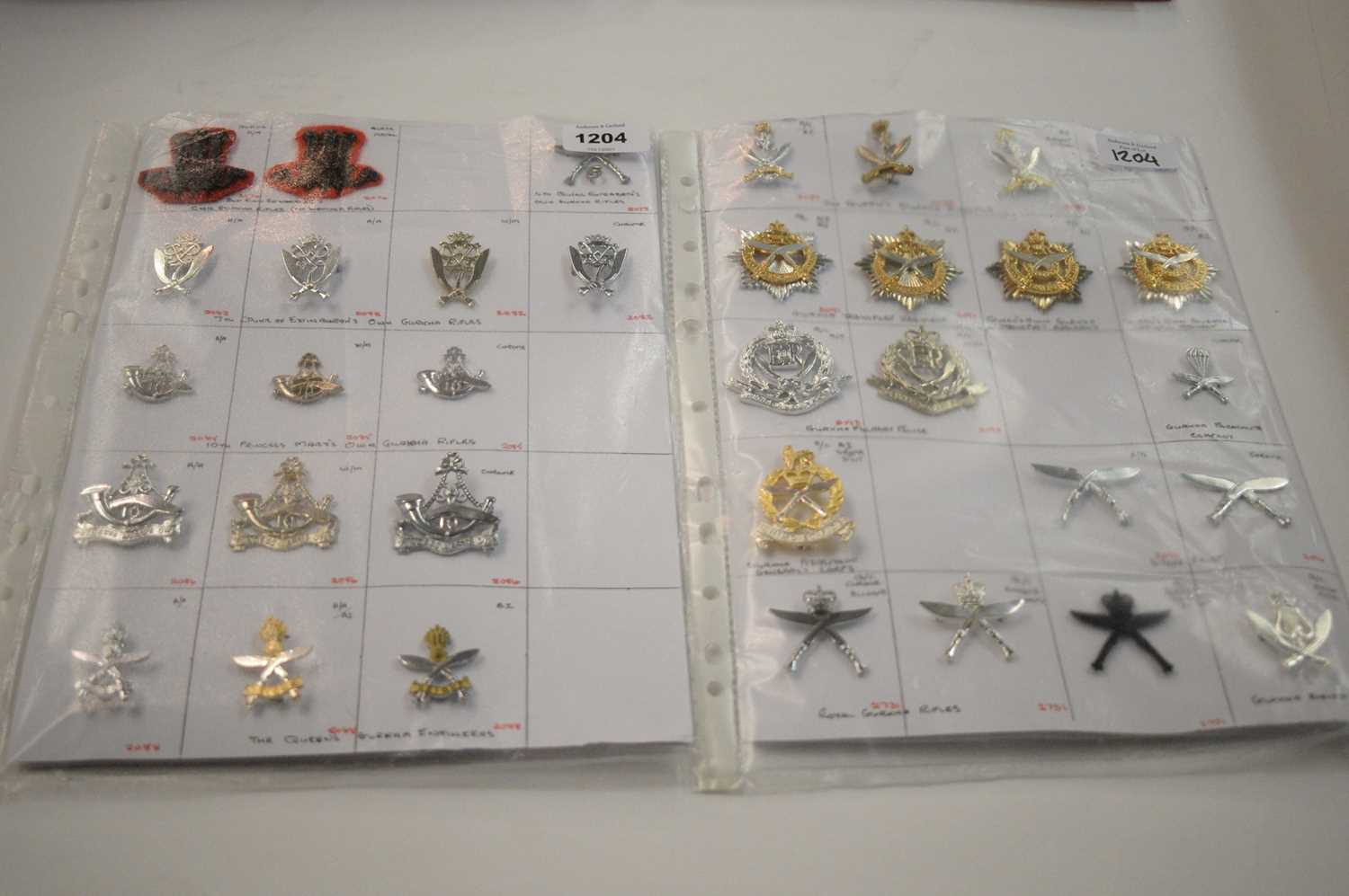 Lot 1204 - A collection of 33 Gurkha cap badges.