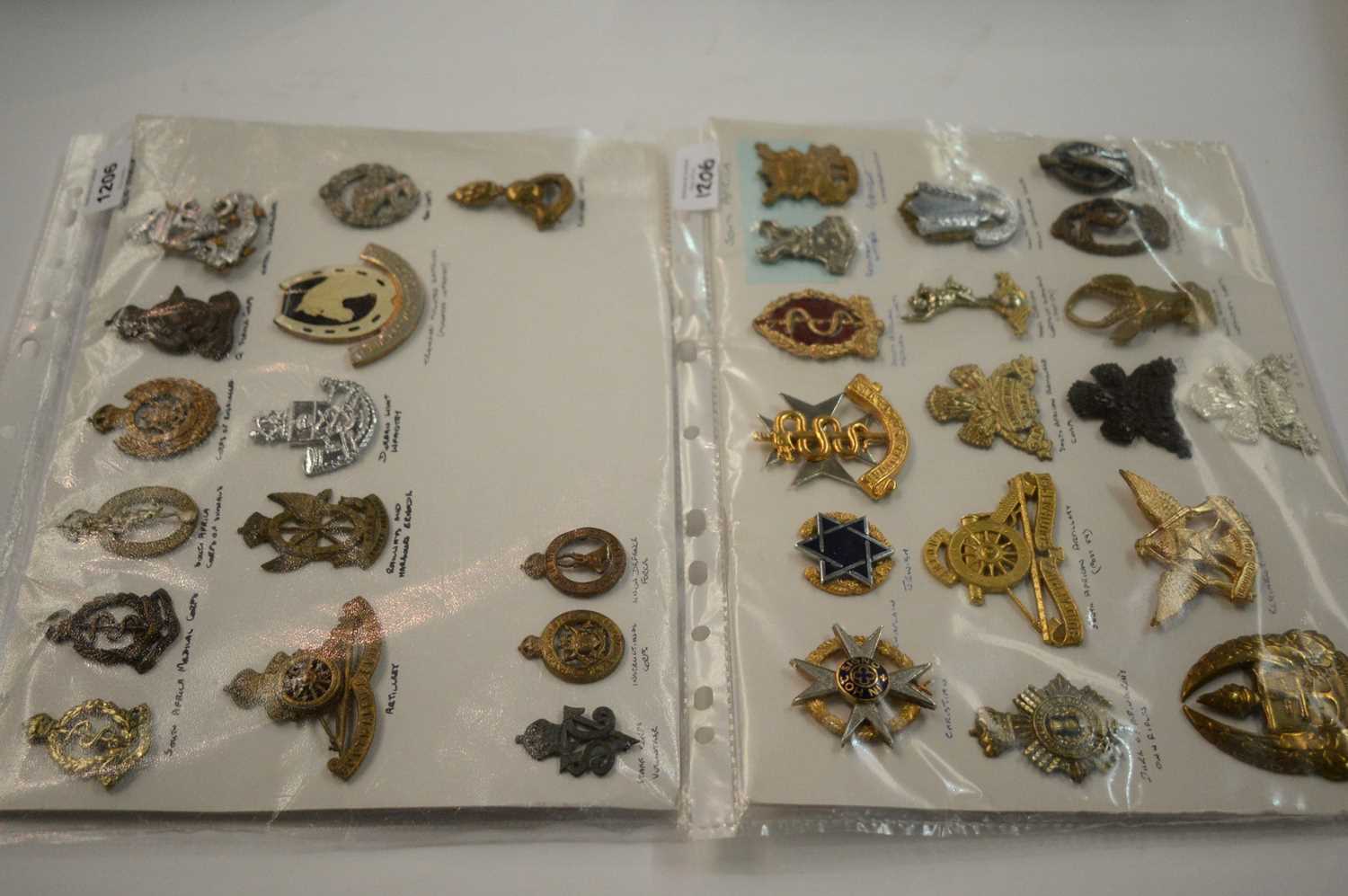 Lot 1206 - A collection of 33 South African miniature cap badges.