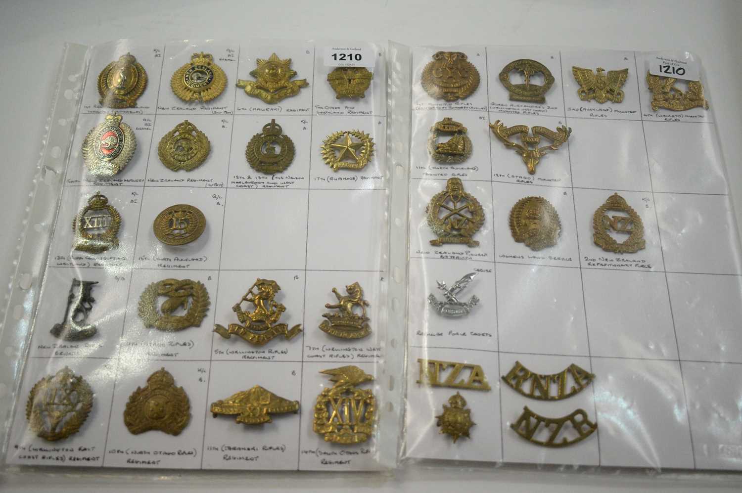 Lot 1210 - A collection of 32 New Zealand cap badges.