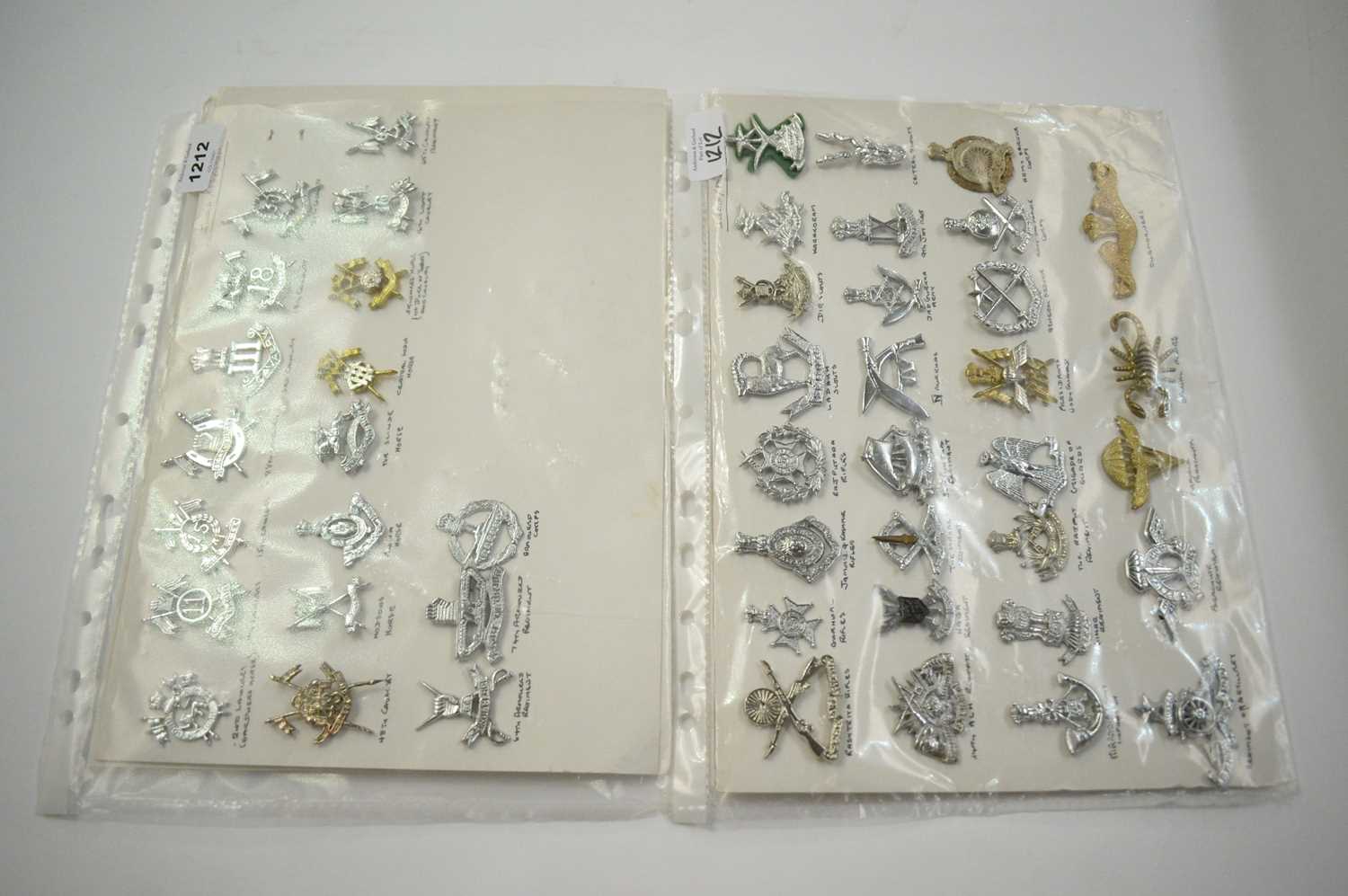 Lot 1212 - A collection of 48 Indian and Pakistani cap badges.