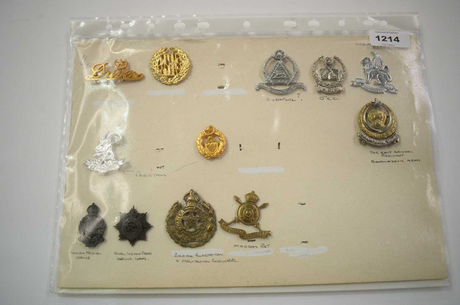 Lot 1214 - A collection of Indian and Pakistani cap badges.