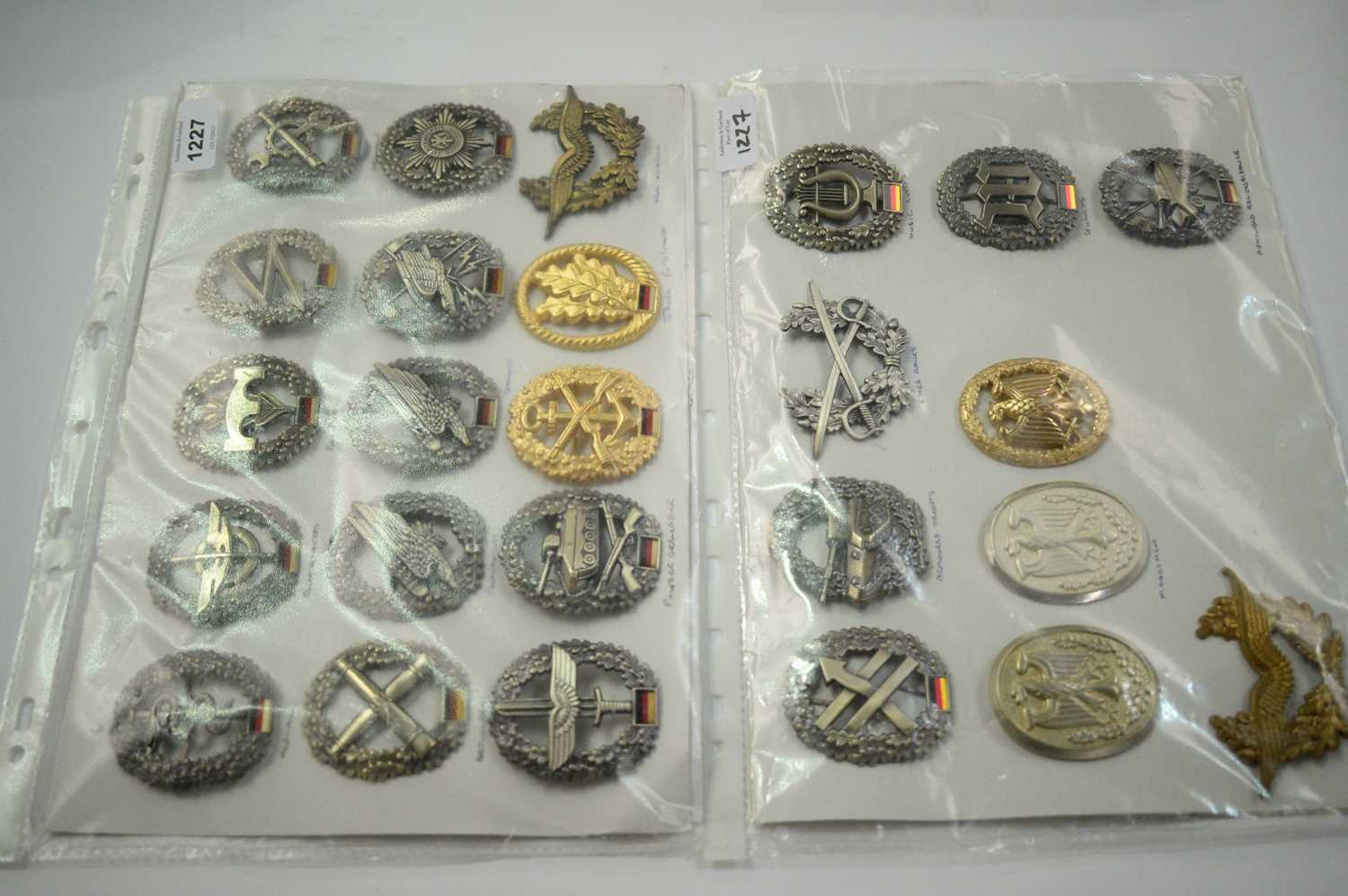 Lot 1227 - A collection of 25 German Vundexwehr cap badges.