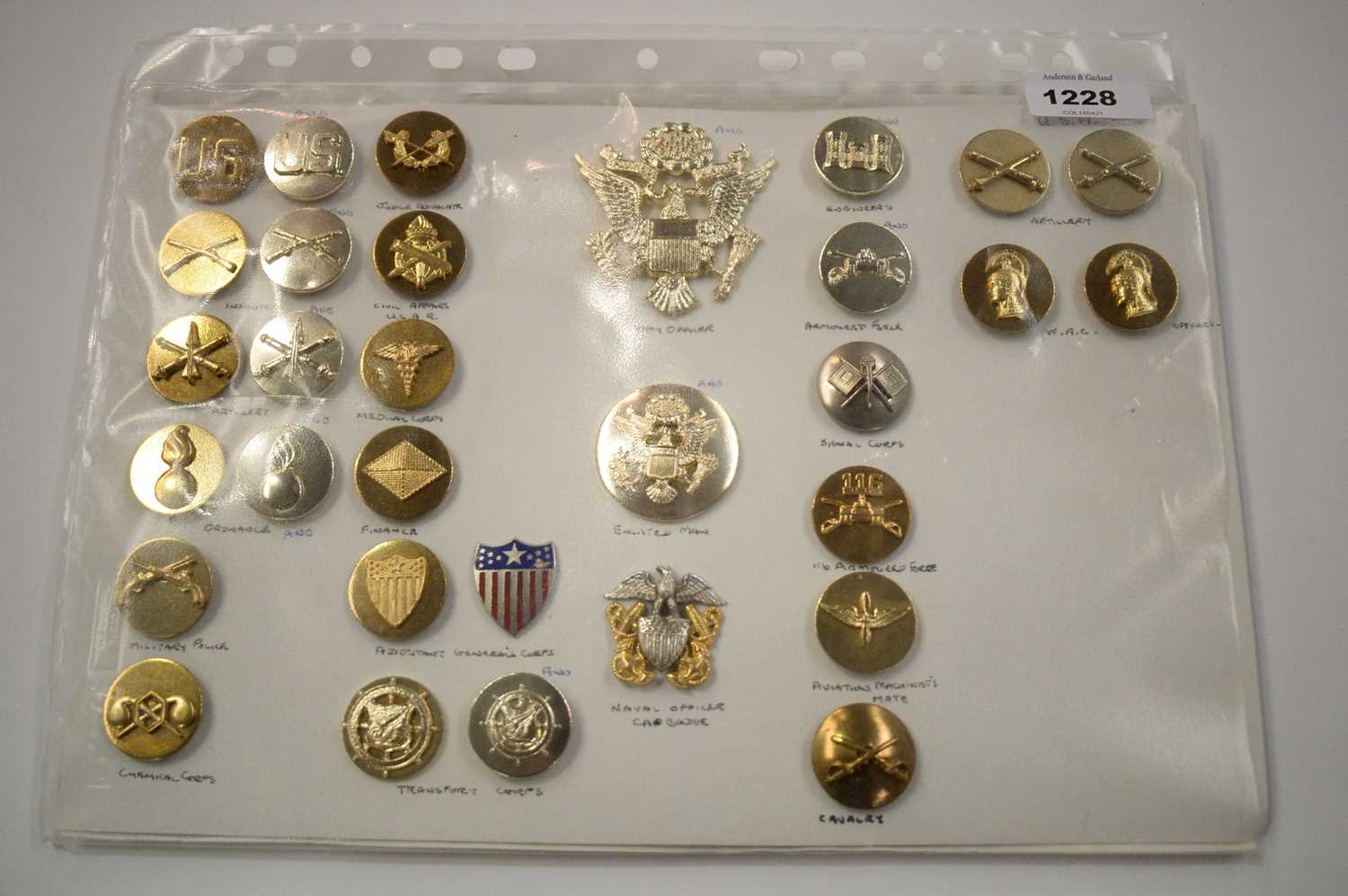 Lot 1228 - A collection of 31 American metal Insignia badges.