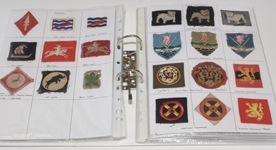 Lot 1252 - A collection of approximately 140 WWII Military cloth badges.