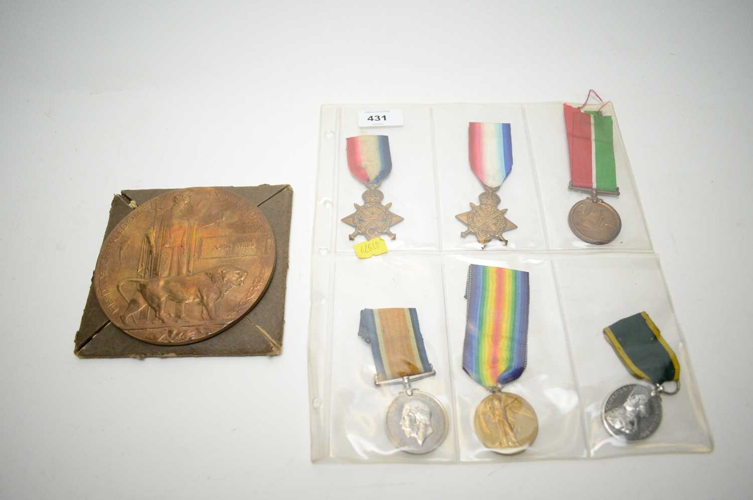 Lot 431 - WWI commemorative plaque; and other medals.