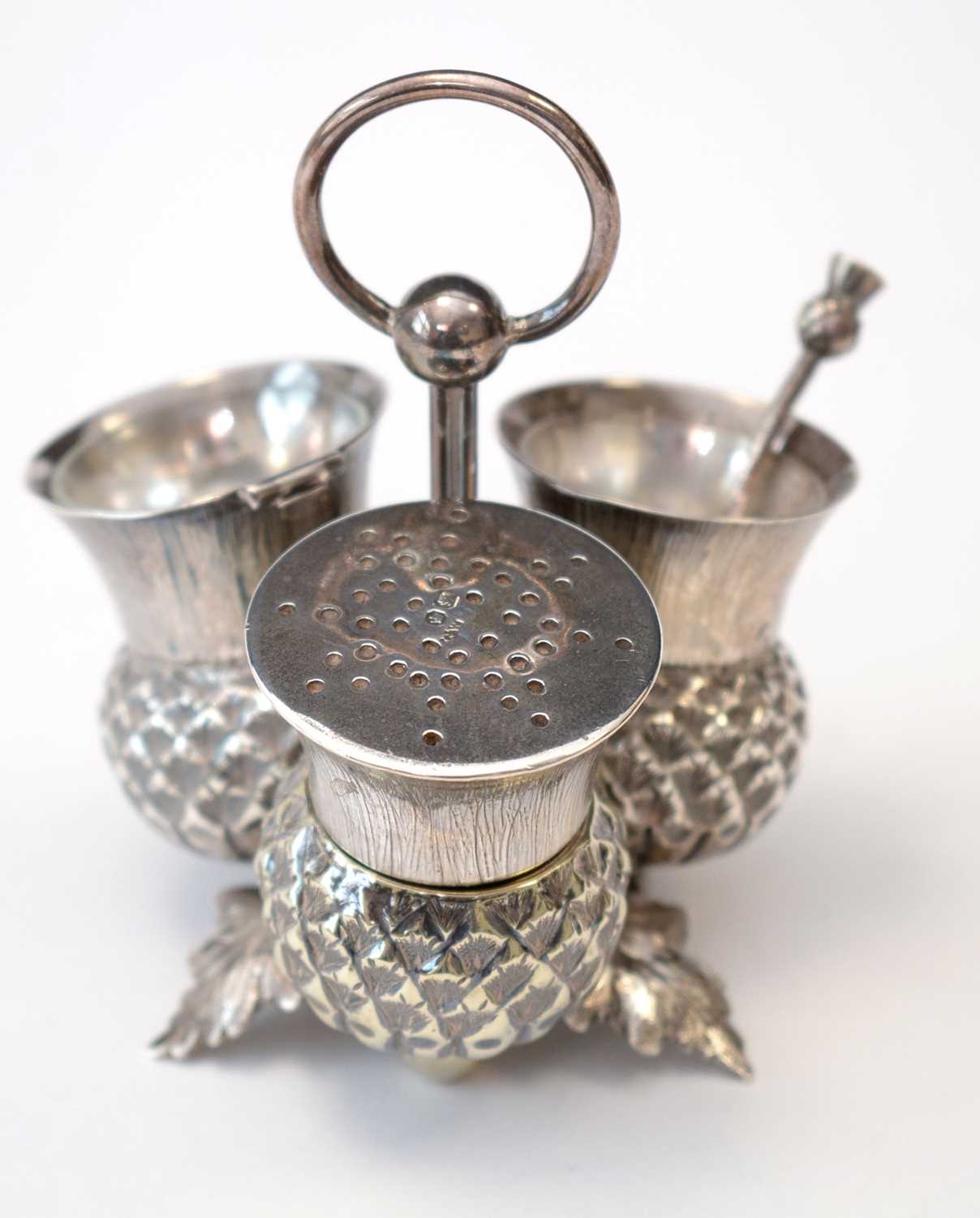 Lot 215 - Victorian silver condiment stand and matching salt spoon.