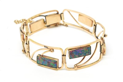 Lot 55 - An opal and yellow metal bracelet.