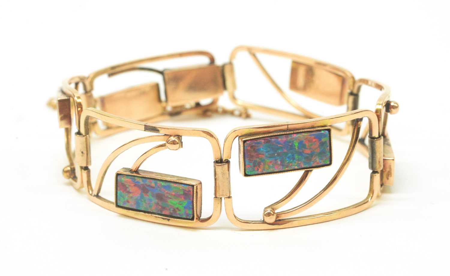 Lot 55 - An opal and yellow metal bracelet.
