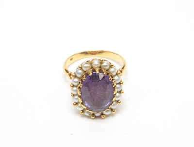 Lot 56 - A synthetic colour change sapphire and cultured pearl cluster ring.