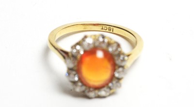 Lot 69 - A fire opal and diamond cluster ring