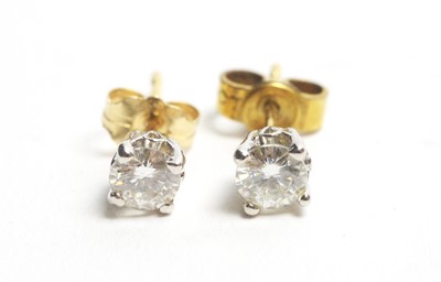 Lot 70 - A pair of diamond stud earrings