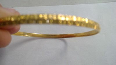 Lot 199 - Selection of yellow metal bangles.