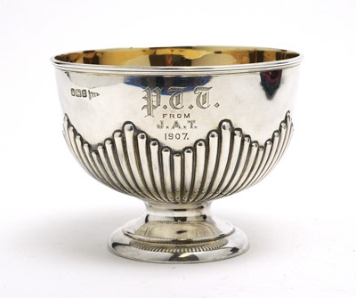 Lot 165 - An Edwardian silver sugar bowl and spoon.