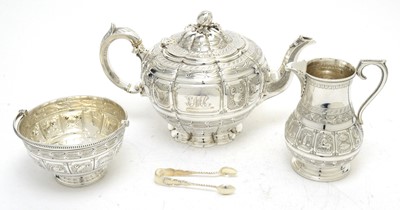 Lot 149 - A Victorian silver teapot, with associated sugar basket and milk jug; and sugar tongs.