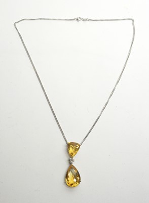 Lot 15 - A citrine and diamond drop pendant