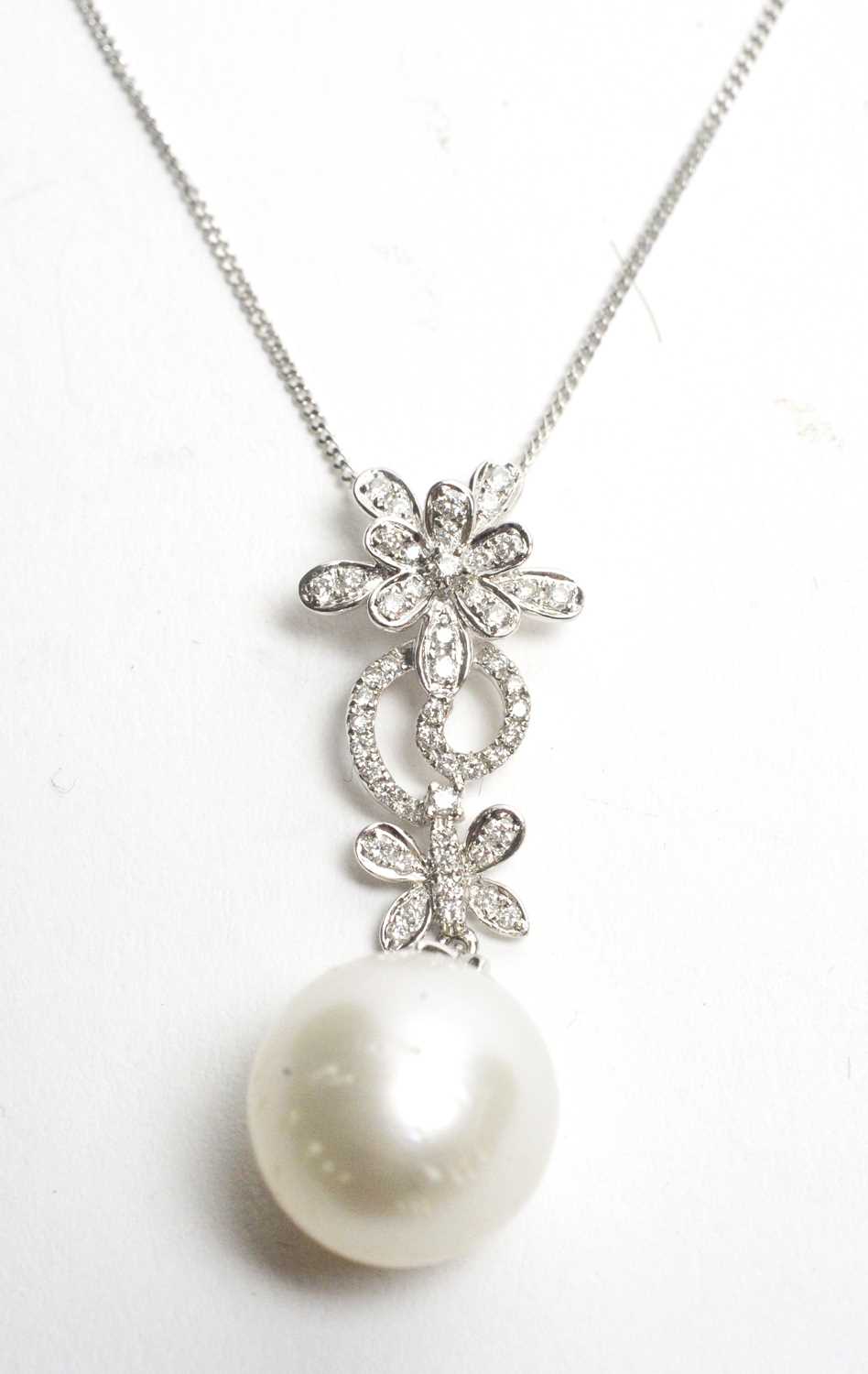 Lot 16 - A pearl and diamond pendant