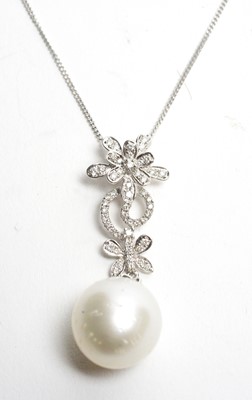 Lot 16 - A pearl and diamond pendant