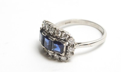 Lot 17 - A sapphire and diamond cluster ring