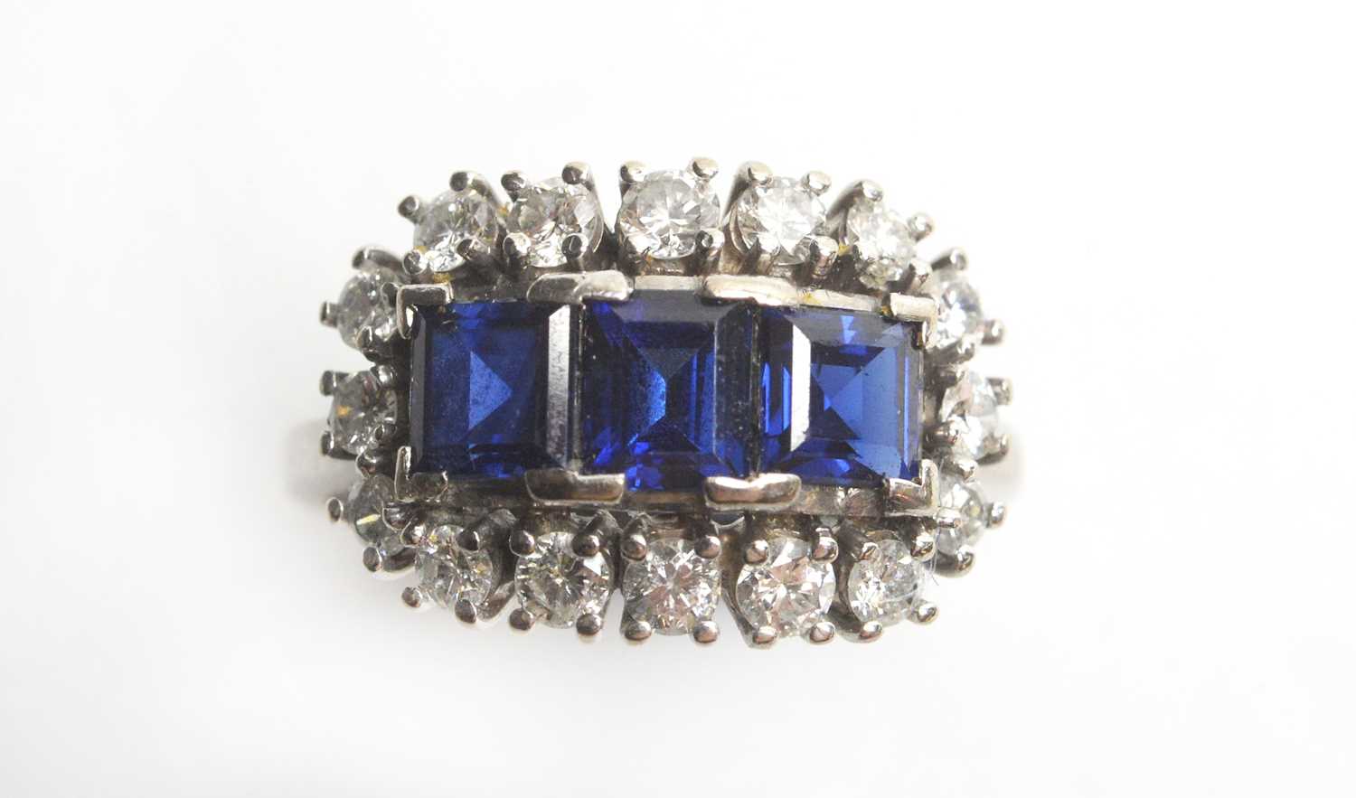 Lot 17 - A sapphire and diamond cluster ring