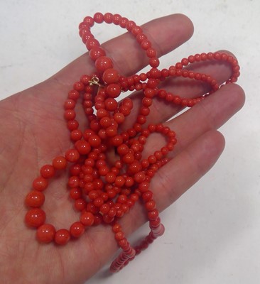 Lot 30 - A three row coral bead necklace