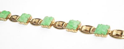 Lot 32 - Carved jade and 9ct yellow gold bracelet