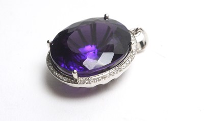 Lot 34 - An amethyst and diamond cluster pendant