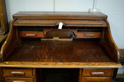 Lot 108 - Early 20th C oak roll top desk.
