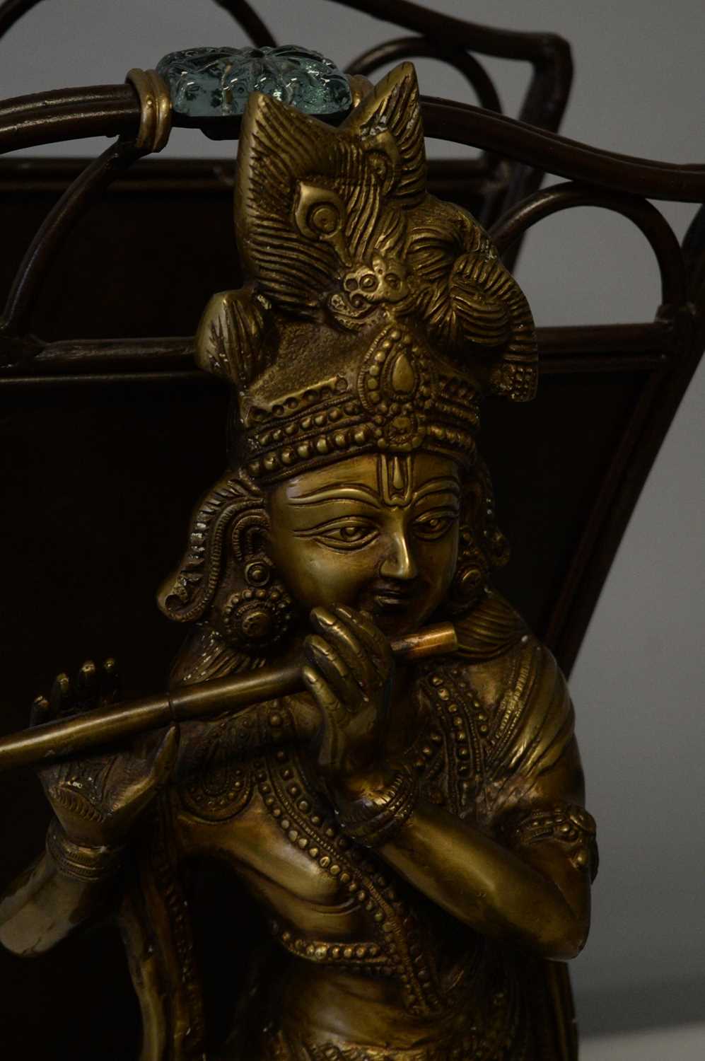 Lot 317 - Repro Indian brass deity; Asian trivet; and a repro bronzed magazine rack.